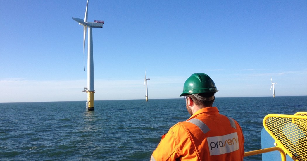 image is A Proserv Technician Surveys An Offshore Wind Farm