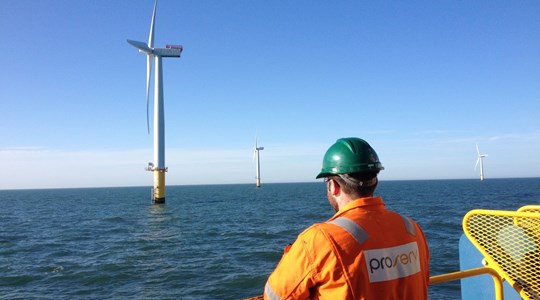 A Proserv Technician Surveys An Offshore Wind Farm