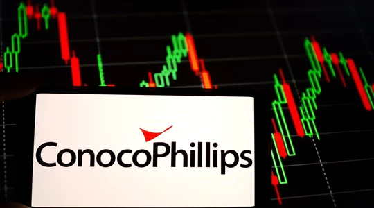 Conocophillips logo on a phone screen with data in the background