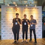 Posing at the entrance of the IMOX Exhibit Hall, Radisson Convention Center, Batam, Indonesia from left to right: Jayden Lee (BD Manager), Kayne Kim (COO), and Nico Rivera (Global BD Manager)